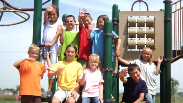 Group portrait of students on play structure