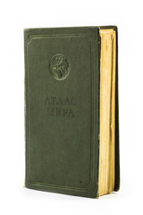 Старая книга "Атлас мира" на белом фоне