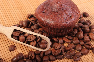 Fresh baked chocolate muffins and coffee grains