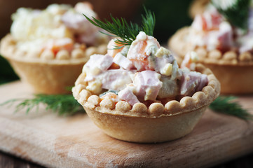 Traditional russian salad Olivier served in tartlet
