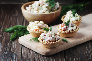 Traditional russian salad Olivier served in tartlet