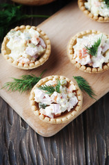 Traditional russian salad Olivier served in tartlet