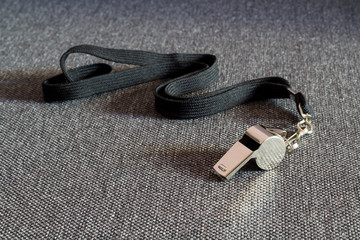 Whistle with a Black Strap