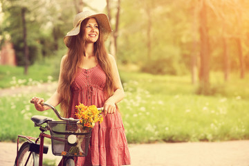 Young woman and bike