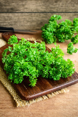 Bunch of parsley on a rustic wooden table