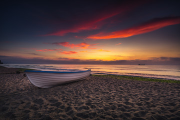 Boat and violet sunrise