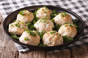 Delicious meatballs with parsley close-up on a plate. horizontal 
