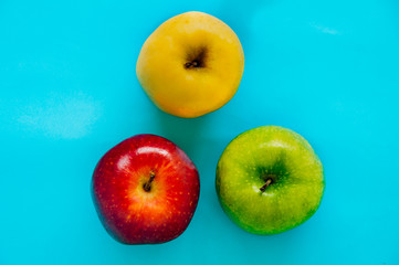 Top view of Red, green and yellow apple different in color on a