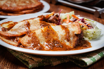 Potato pancakes with meat stew served