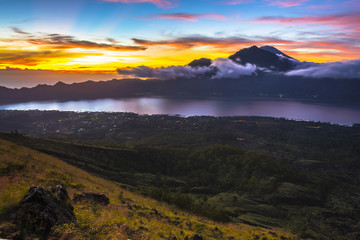 Fototapeta na wymiar Mount Batur Sunrise Trekking. Mount Batur (Gunung Batur) is an active volcano located at the center of two concentric calderas north west of Mount Agung on the island of Bali, Indonesia.