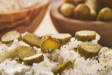 sandwiches with rye bread, cream cheese and marinated cucumbers, vintage toned