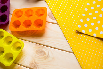 molds for desserts on the wooden background
