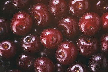 fresh cherries top view background, vintage toned