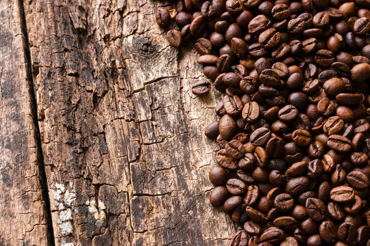 roasted coffee beans on a wooden background top view