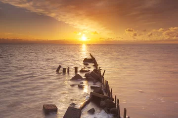 Gordijnen Sunrise over sea on the island of Texel, The Netherlands © sara_winter