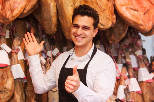 smiling salesperson in the store jamon