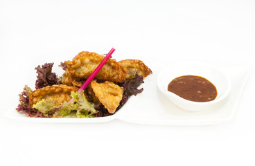 Japanese dumplings with lettuce on white background