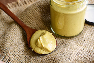 Mustard sauce on rustic wooden table
