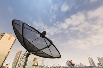 Black Satellite dish and moving sky