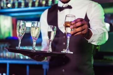 Bartender serving champagne