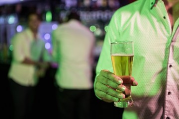 Man posing with glass of beer
