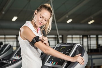 Fototapeta na wymiar Woman exercising on a treadmill