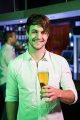 Man posing with glass of beer