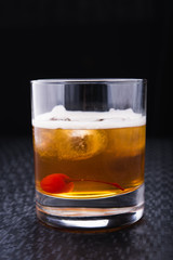 alcoholic cocktail with cherry