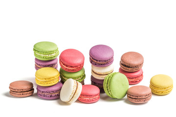 Fresh pile of macaroons on white background