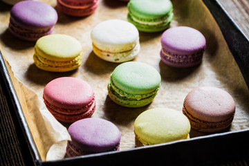 Fresh macaroons on baking paper