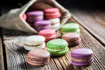Fresh macaroons on wooden table