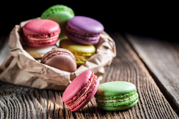 Fresh macaroons in paper bag