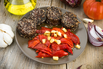 fried peppers and sausage served on wooden