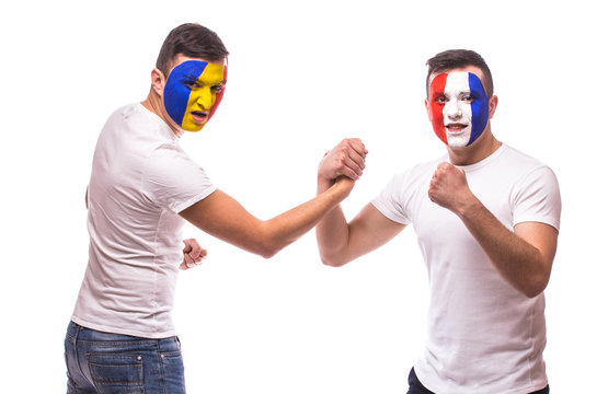 France vs Romania. Football fans of national teams friendly handshake before match on white background. European football fans concept.