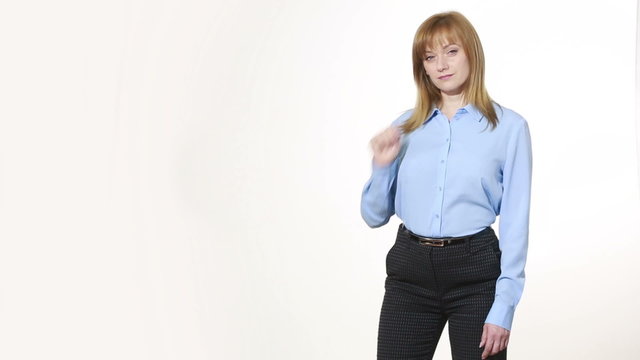 rubs his eyelids. lies gesture. girl in pants and blous.  Isolated on white background. body language. women gestures. nonverbal cues