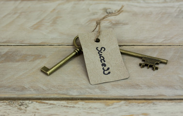 Antique keys on wooden background