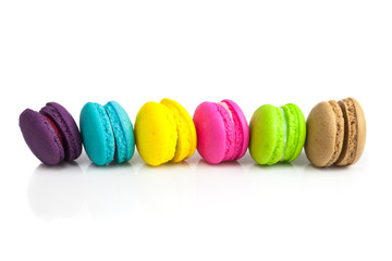 Colorful french macaroons on a white background.