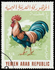 Fototapeta na wymiar Stamp printed in the Yemen shows Rooster