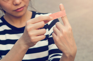 Close up bandage on an injured finger, outdoor.