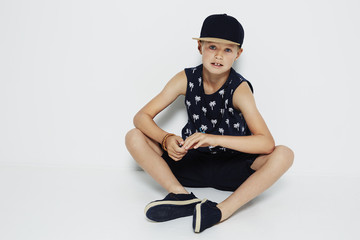 Cool young boy in summer fashion, studio