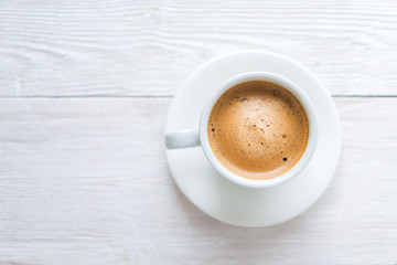 White cup of espresso coffee