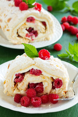 meringue roulade with cream and raspberries