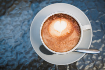 White cup of coffee on a table