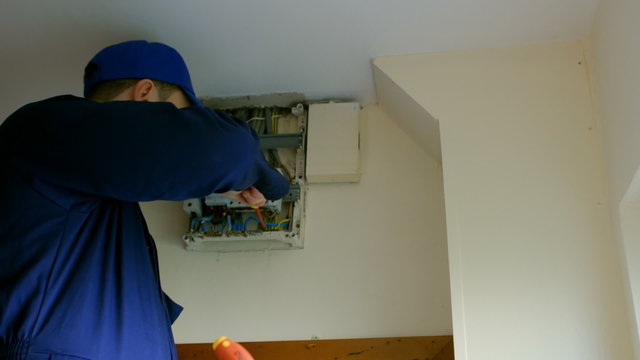 Man fixing the fusebox