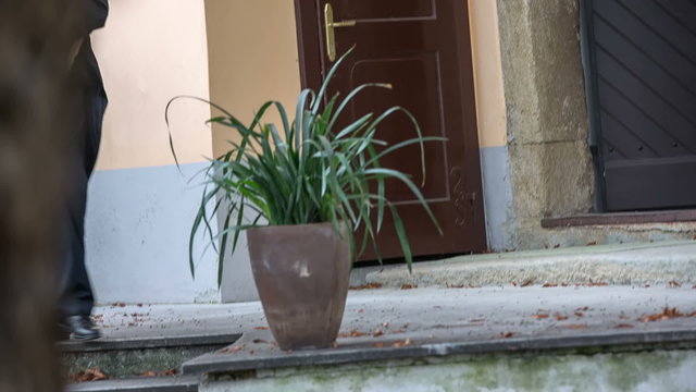 Man from modern times walks out of the house
