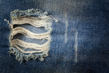 The old blue jeans dirty at torn for background.