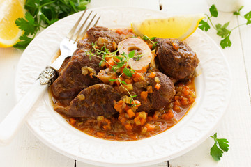 ossobuco with polenta on the Milanese. Italian Cuisine.