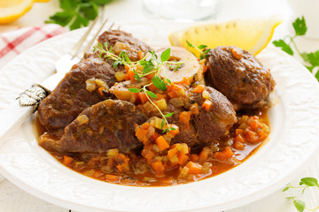 ossobuco with polenta on the Milanese. Italian Cuisine.