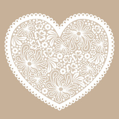 White lacy heart on beige background