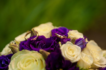 Wedding rings and bridal bouquet